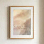 A framed art print with a light wood frame and white mat, featuring an abstract soft-focus background in warm beige and pink tones with the text 'Not forcing. Not resisting.