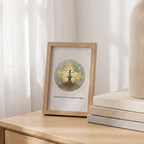 Inner Light tree wall art framed on a wooden shelf on a bedside table